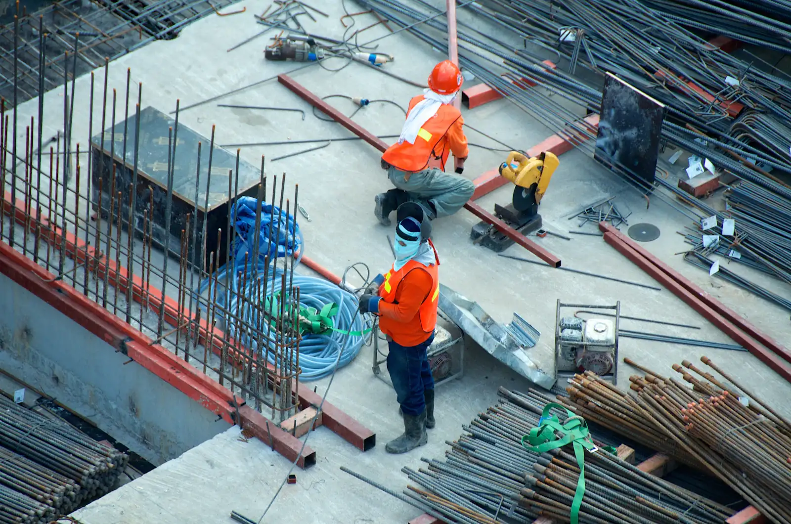 Two construction workers on structural steelwork